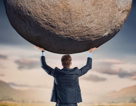 Businessman lifting and holding a big boulder above head. Solving an immense task, symbol of strength and perseverance. Standing up to troubles, burden concept