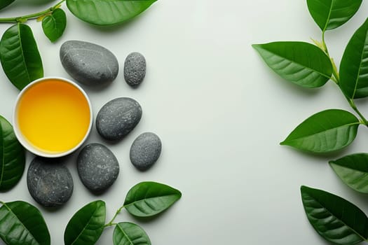 A white bowl with yellow liquid and a bunch of rocks on a table. The scene has a calming and relaxing mood, as the rocks