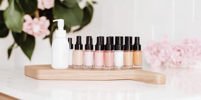 Nail polish bottles of neutral colors arranged on a marble background, AI Generated