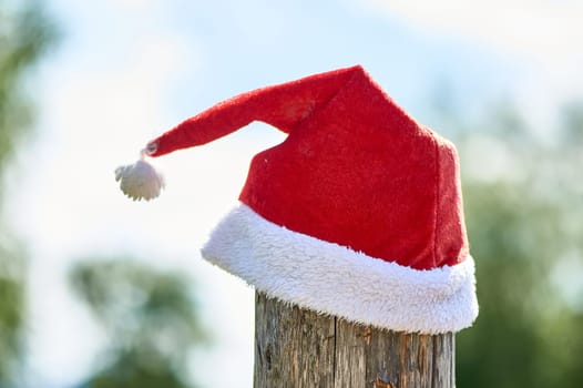 santa Claus hat is put on a pole. High quality photo