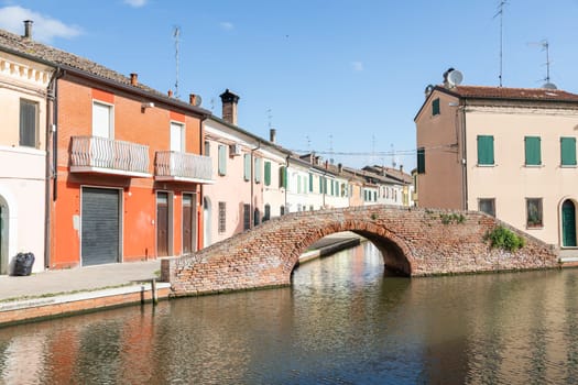 Comacchio, Italy - 11 June 2024. Characteristic village named Little Venice, with bridges and canals.