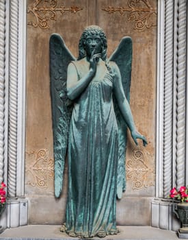 Monument of old angel in Catholic cemetery