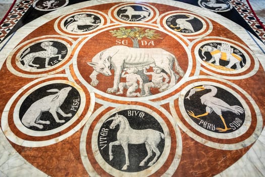 Siena, Italy - August 07, 2024: detail of the Duomo cathedral floor with marble mosaic.