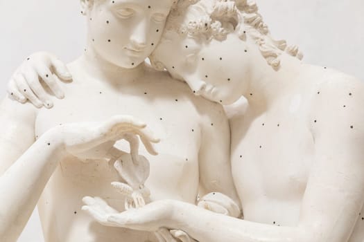 Possagno, Italy - 29 June 2023: Cupid and Psyche statue by sculptor Antonio Canova, 1800. Sensual hug, love and togetherness emotion.