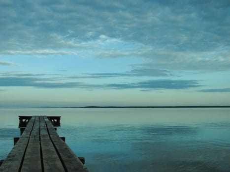 A long wooden pier on the shores of Lake Naroch, Belarus.