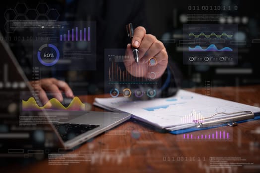 Hand analyzing financial and statistical data through holographic graphs and charts. Highlights business intelligence, performance tracking, and trends.
