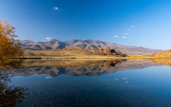 Lake in the Altai Mountains. Panorama of the Altai landscape in the mountains. The time of year is autumn.