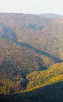 Mountains and forests of Crimea. coniferous and deciduous trees on the hills of the mountains and rocks