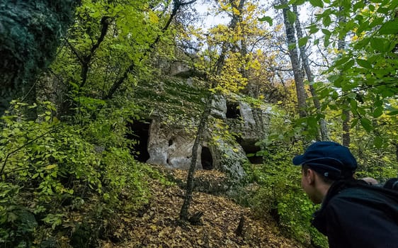 Caves in the forest of Crimea. Old caves in the rocks.
