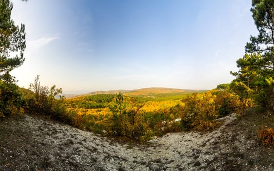Mountains and forests of Crimea. coniferous and deciduous trees on the hills of the mountains and rocks