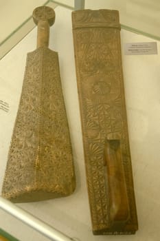 Valek - A flat wooden block with a handle for knocking out linen while rinsing or for rolling it on a rolling pin. Russian culture, museum.