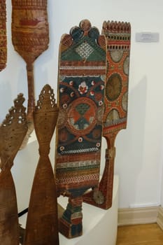 Wood carvings, spinning with folk Russian ornaments.