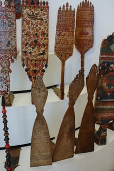 Wood carvings, spinning with folk Russian ornaments.