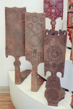 Wood carvings, spinning with folk Russian ornaments.