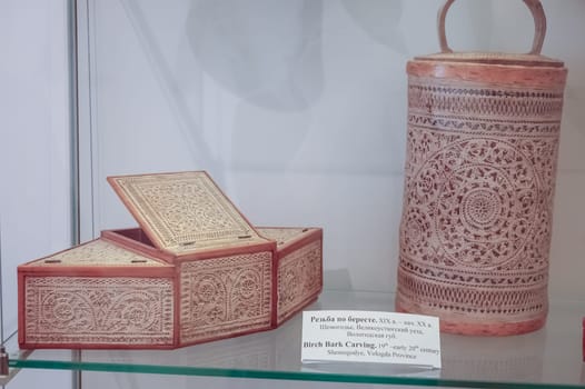 Moscow, Russia - May 24, 2019: Ancient caskets made of wood and birch trees. Russian culture.