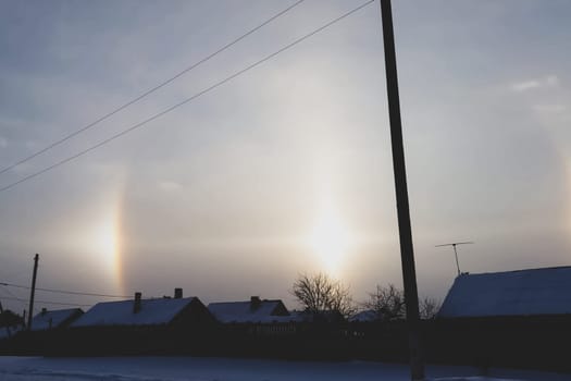 The phenomenon of halo in the sky. A rare natural phenomenon. Three halo suns.