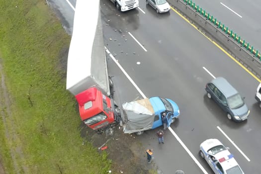 Moscow, Russia - June 24, 2020: Accident involving a truck with a wagon and a minivan. The truck drove off the road.