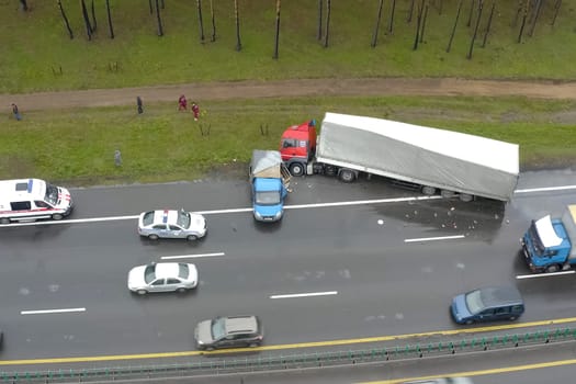 Moscow, Russia - June 24, 2020: Accident involving a truck with a wagon and a minivan. The truck drove off the road.