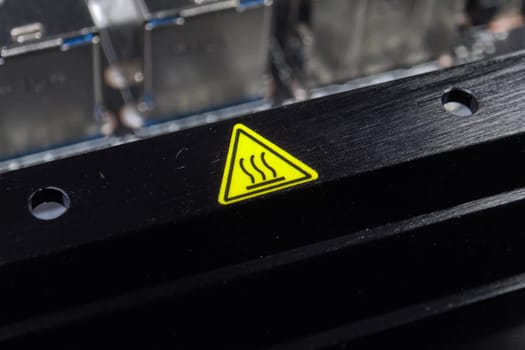 Yellow hot surface sign. Designation of a hot radiator.