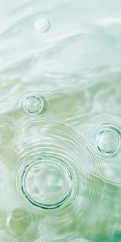 Ripples in clear blue water with abstract circular patterns, suitable as calming SPA background, AI generated