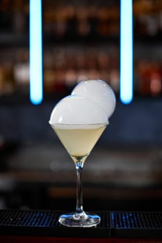 exotic alcoholic cocktail with smoky air bubble at the bar. soft drink on the bar table.