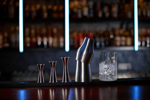 different bar steel tools for preparation cocktails on bar counter.