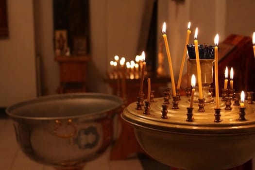 Candlelit church ceremony: atmospheric glow in sacred space.