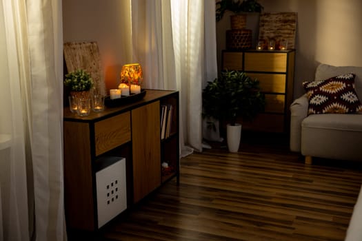 A warm and welcoming living room that features stylish decor elements, beautiful accessories, and soft subtle lighting