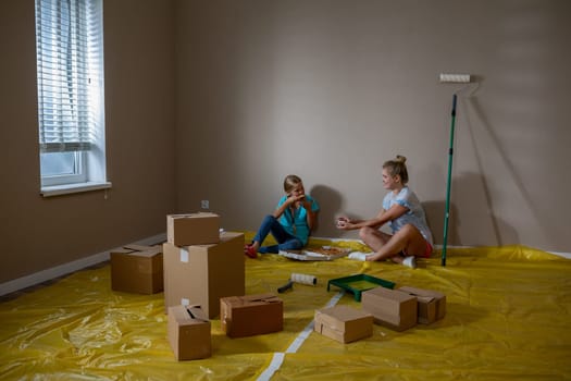 Children are happily engaged in playful activities while their home is undergoing a significant renovation