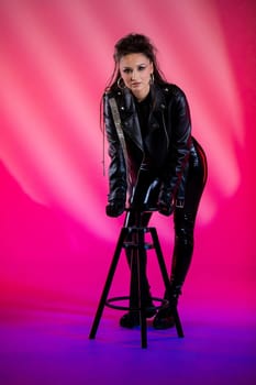 A striking and captivating portrait of an individual showcasing edgy and bold fashion against a vibrant background