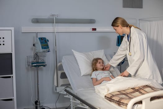 In a bright and cheerful hospital room, a caring doctor is examining a young girl as part of her health checkup