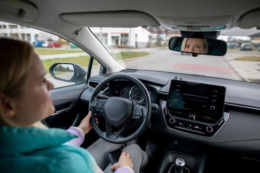 A skilled driver smoothly navigates a sleek and modern electric vehicle through a bustling city landscape