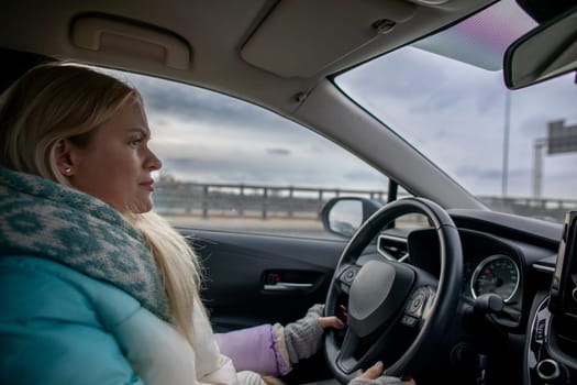 A determined and focused woman skillfully navigating her vehicle through a challenging stormy landscape