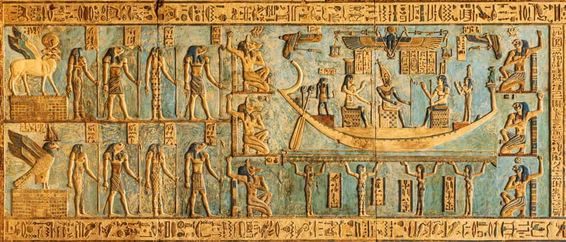 Carvings on the ceiling with restored painting in the temple of Hathor at Dendera in Egypt