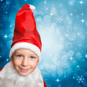 snowing on child in santa clothes