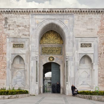 Istanbul, Turkey - May 11, 2023: Topkapi Palace: Imperial Gate, aka Saltanat Kapisi, or Royal Gate, leads to the First Courtyard of the palace