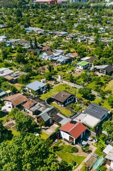 Aerial view of a cluster of houses and gardens in Mannheim, Germany. Suburb and urbanization concept, tightly packed homes.
