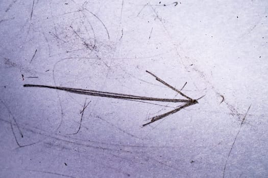 Grunge gritty doodle scratches, old paper. Vintage paper texture with dust scribble arrow. High quality photo