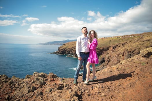 Tourists admiring breathtaking coastal landscape at ponta de s o louren o, madeira island, portugal