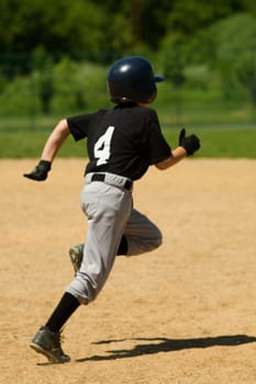 Rear view of a baseball player running