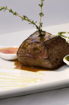 Close-up of meat loaf with a spoon full of gravy in a plate