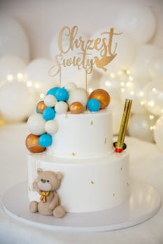 This wonderful twotier cake boasts vibrant decorations along with an adorable teddy bear, perfect for any celebrations