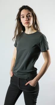 A poised model with hands in pockets showcases contemporary casual fashion in stylish gray and black tones