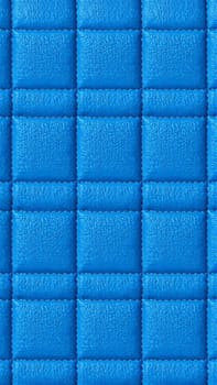 The surface texture of artificial leather is blue, the surface is stitched in the form of diamonds, squares, rectangles. Eco-leather in a kilt. High-quality photos