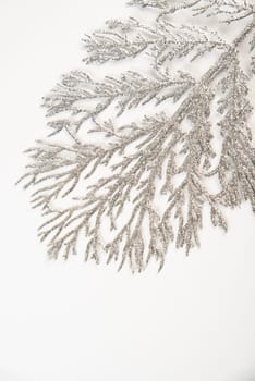 Fake shiny tree branch for decorating of bouquets and home in Christmas.