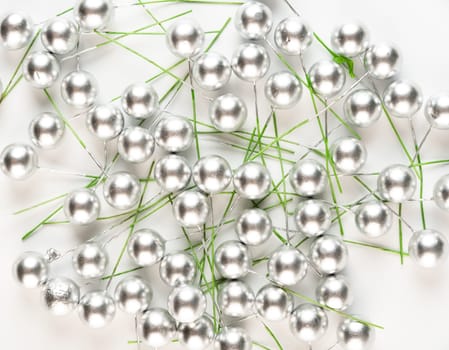 Artificial berries on a wire for needlework and decoration of gifts, wreaths on white background