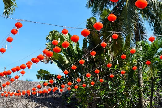 Many red lanterns hanging in Vietnam for Tet Lunar New Year