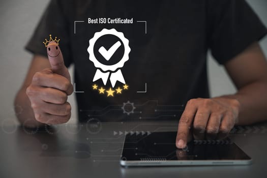 Businessman thumbs up to show assurance of quality and warranty of products and services. ISO 9001 certification and customer database surveys guarantee compliance standards. Standardization concept