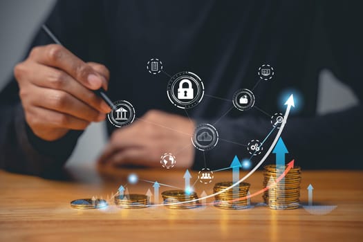 Investment and savings strategy for financial security and retirement. Businessman holding a coin on a stack of coins with a rising graph in the background. Save money and investment growth concept