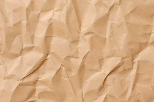 Brown crumpled paper texture. Abstract brown recycled paper background
